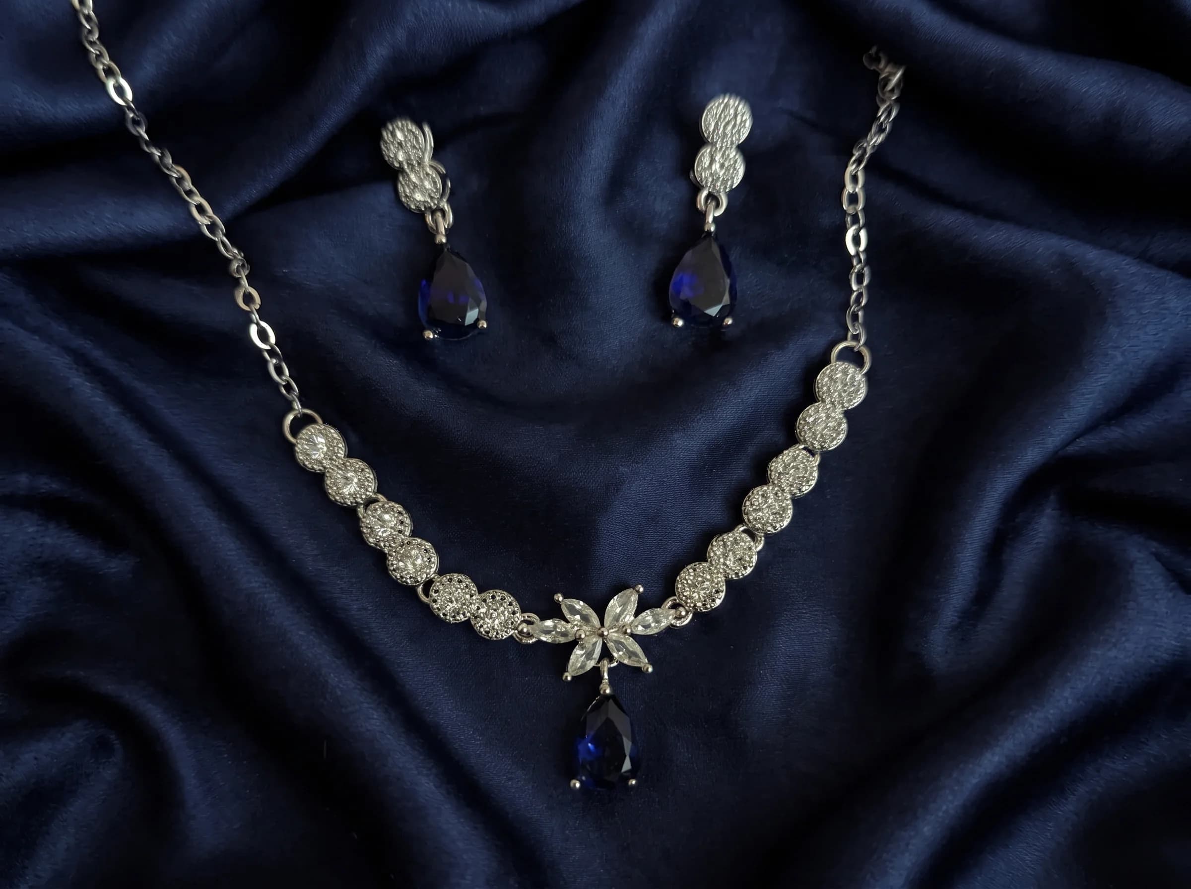 The Signature pear-cut sapphire and pave crystal necklace set