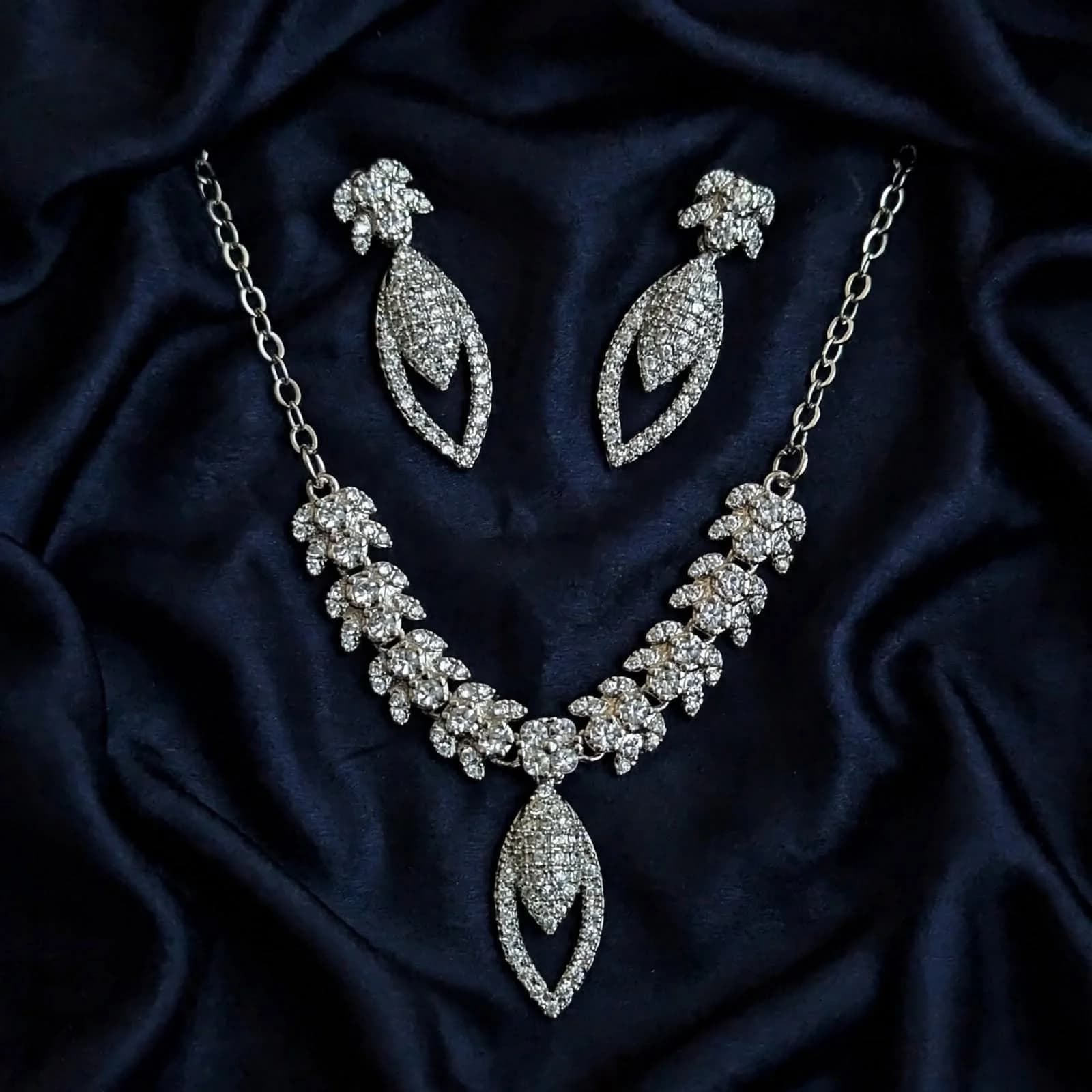 The Aura openwork pave crystal teardrop necklace and drop earrings by Azor