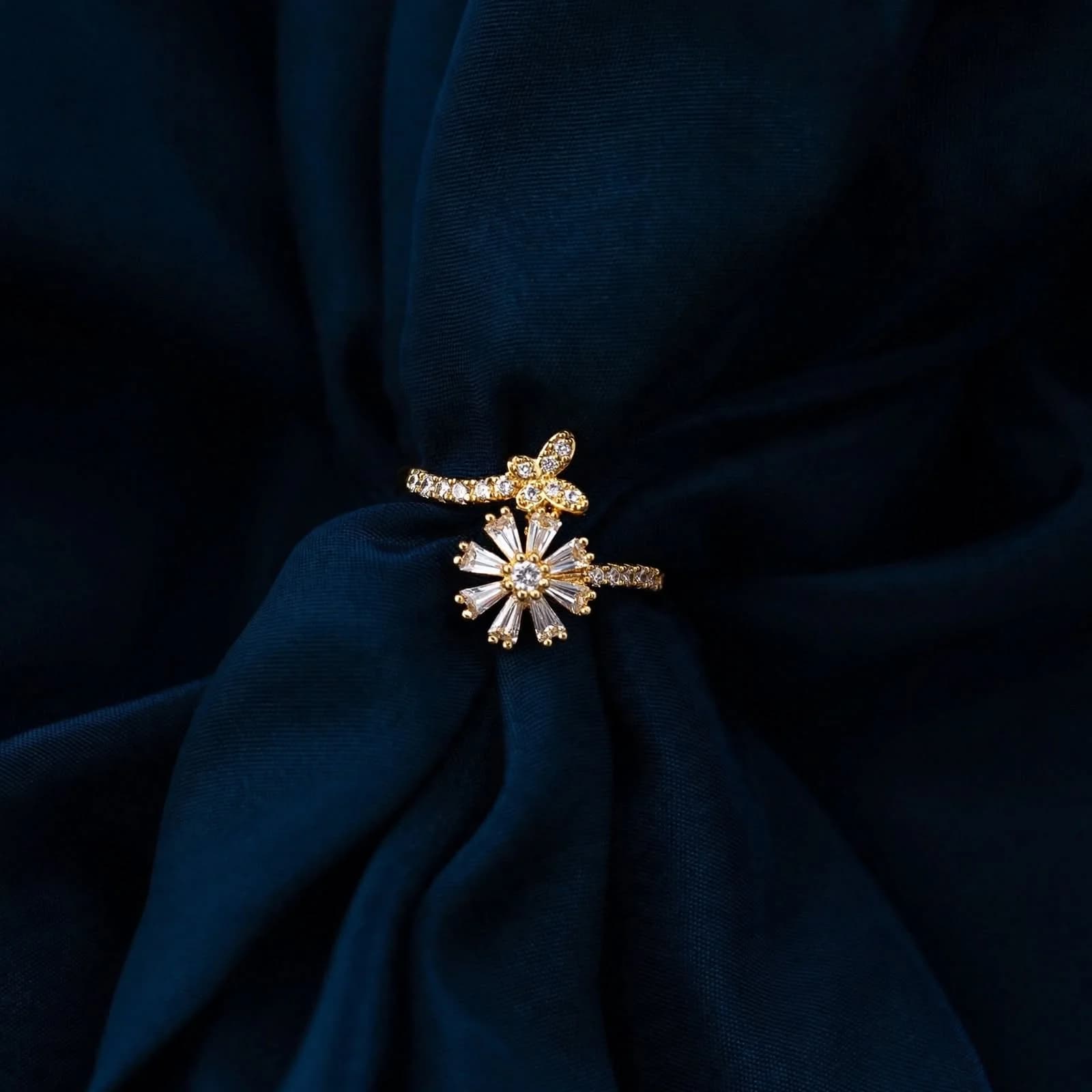 The Jardin gold wrap ring with pave butterfly and baguette floral bloom by Azor