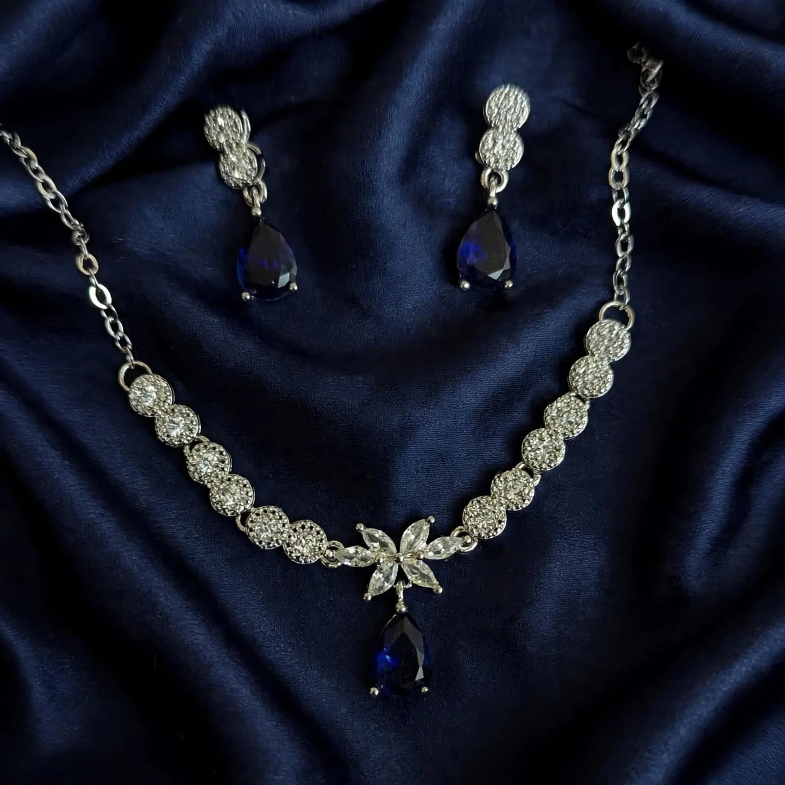 Necklace worn on model collarbone