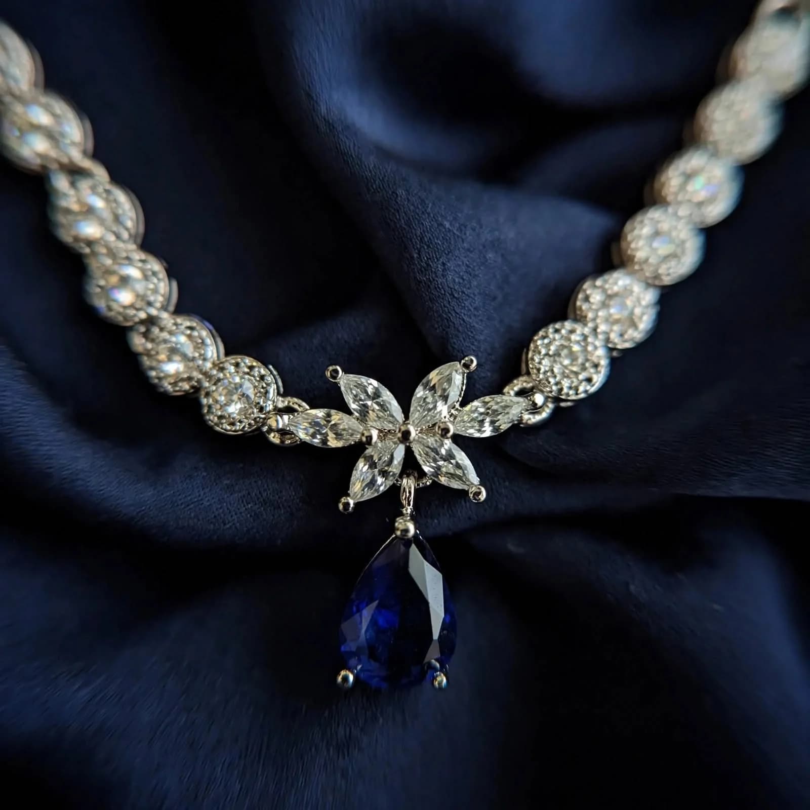The Signature necklace Set with pear-cut sapphire and pave crystal by Azor
