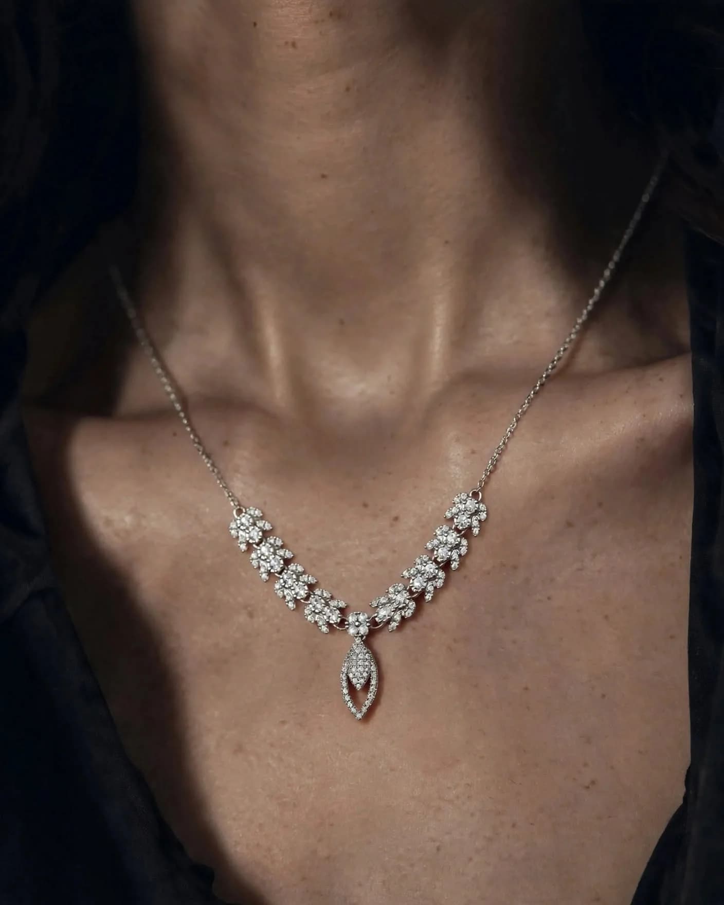 Azor Aura openwork pave crystal teardrop necklace and drop earrings on model