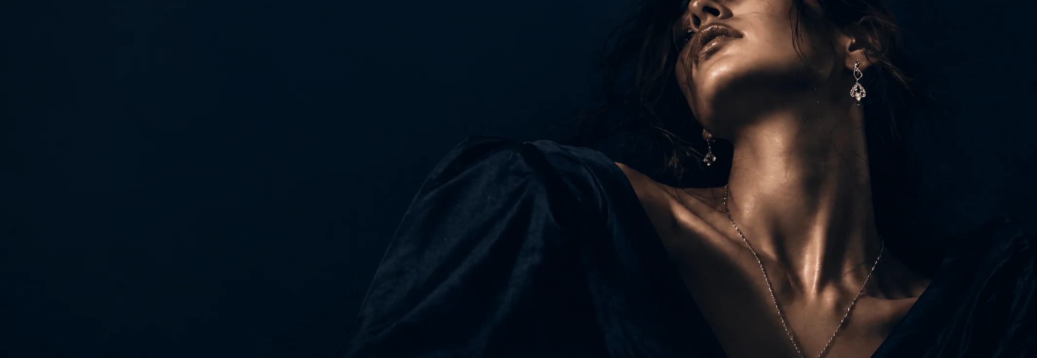 Azor philosophy portrait featuring fine jewelry on dark editorial background
